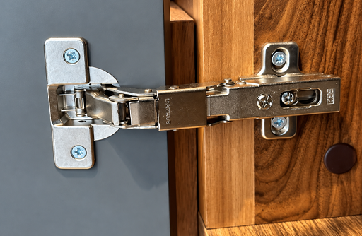 Metal Cabinet Hinge on Wooden Kitchen Cabinet Door